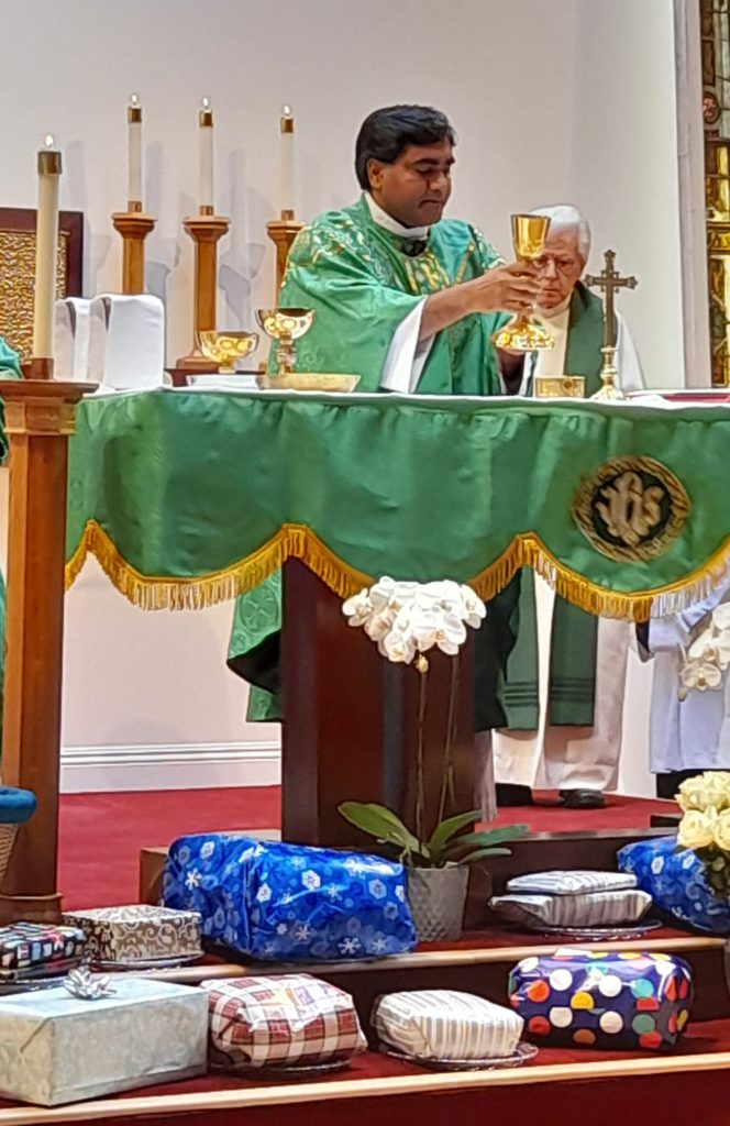 Father Raj saying Mass